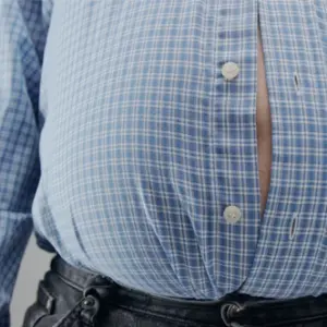A large man unable to fit in his clothes.